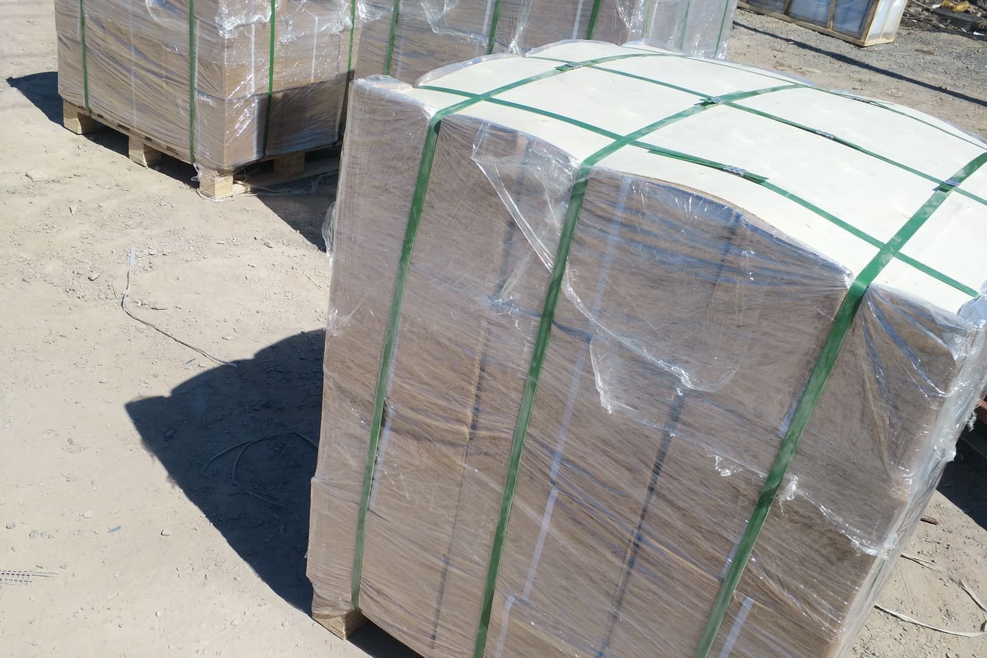 Industrial goods protected on pallets with film and strapping